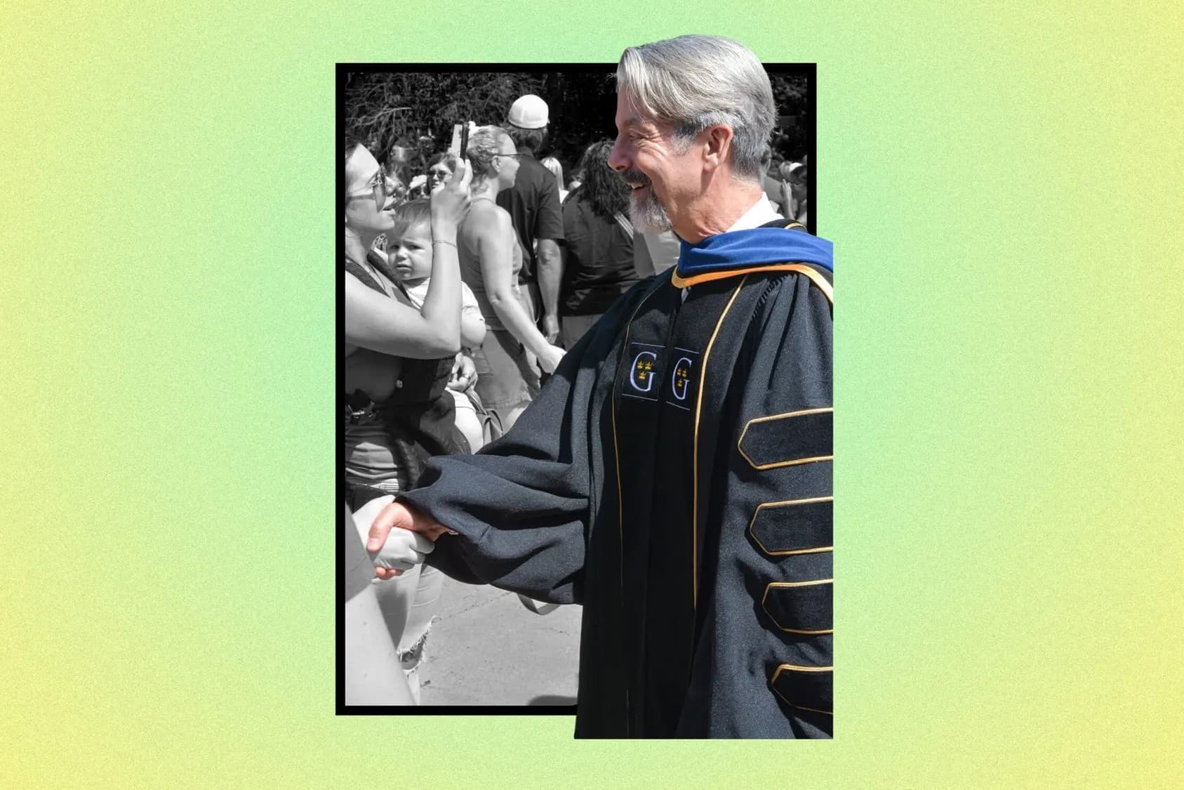 A professor shaking hands with someone