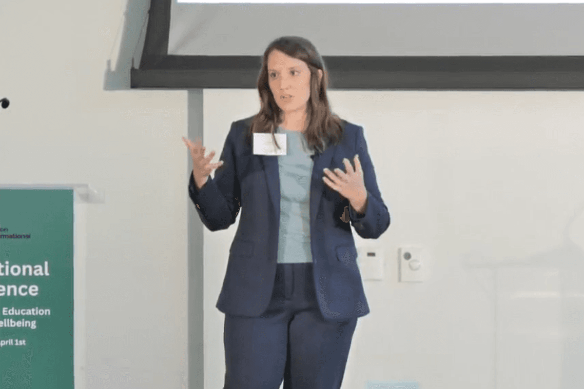 Woman in blue suit on stage